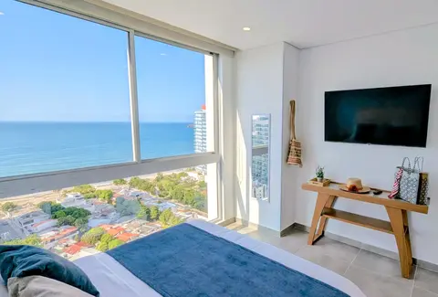 Luxurious master bedroom sanctuary with ocean-inspired tones.